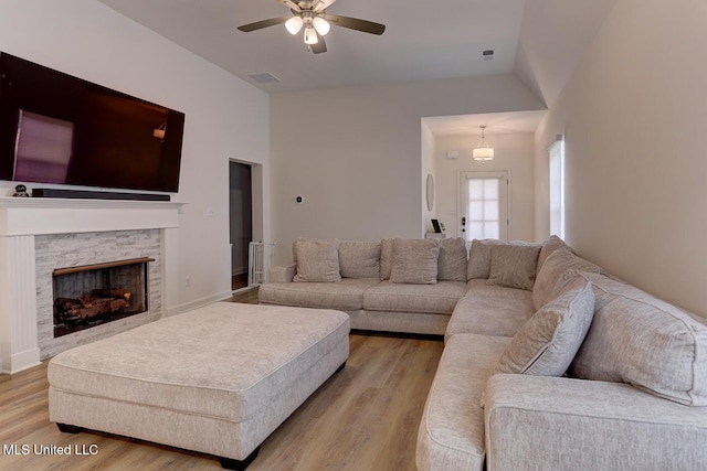 2561 Dela Dr, Southaven, MS 38672 - living room featuring light wood-style floors, a ceiling fan, and a fireplace
