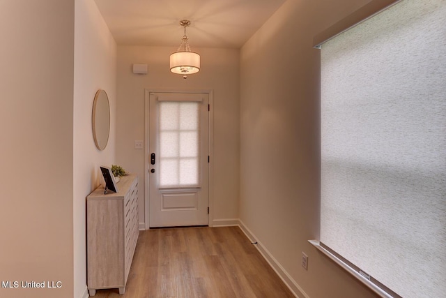 2561 Dela Dr, Southaven, MS 38672 - doorway to outside featuring light wood-style flooring and baseboards