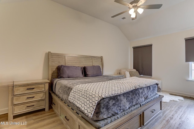 2561 Dela Dr, Southaven, MS 38672 - bedroom with light wood-style floors, lofted ceiling, baseboards, and ceiling fan