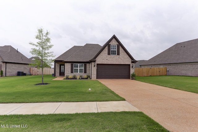 2561 Dela Dr, Southaven, MS 38672 - view of front of home featuring brick siding, concrete driveway, and a shingled roof