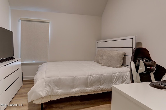 2561 Dela Dr, Southaven, MS 38672 - bedroom with light wood-style flooring and lofted ceiling