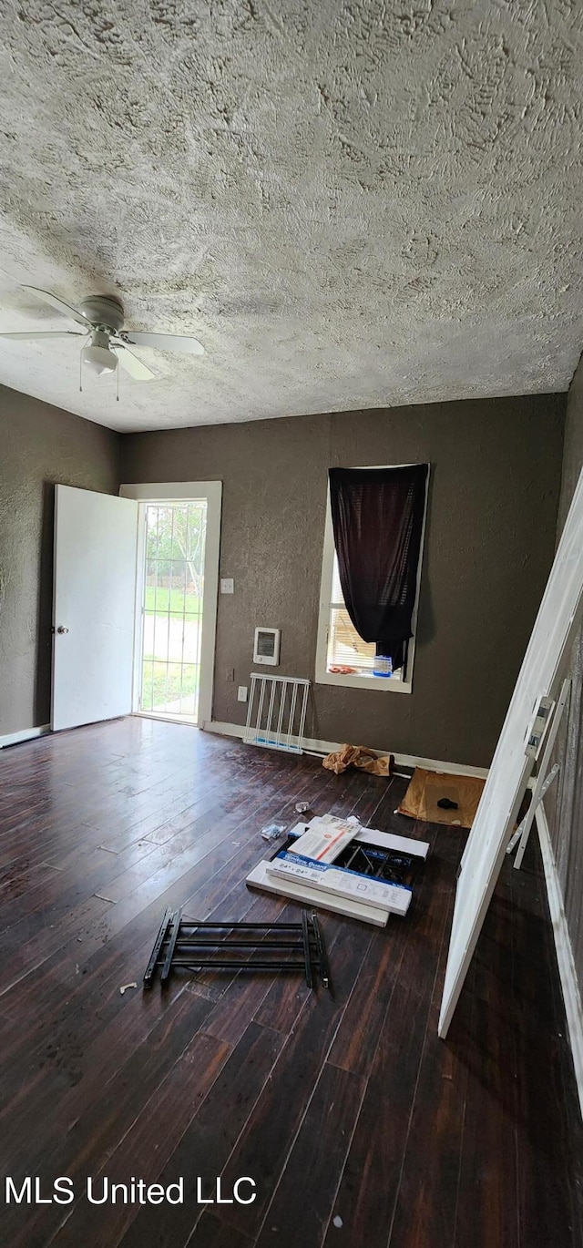 unfurnished room featuring ceiling fan, a textured ceiling, and hardwood / wood-style floors