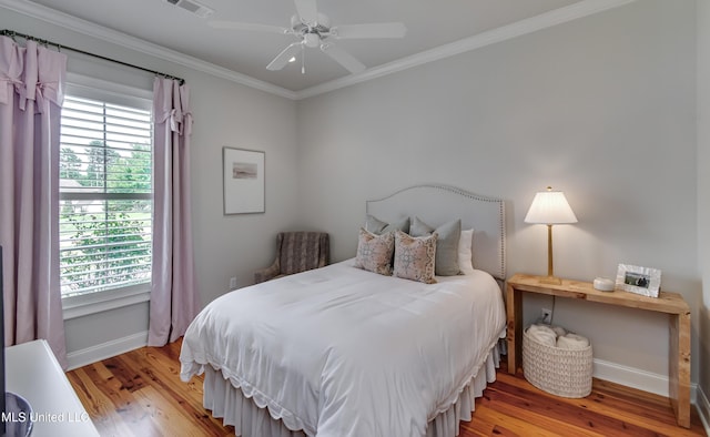 105 Longleaf Ln, Madison, MS 39110 - bedroom featuring wood finished floors, crown molding, multiple windows, and a ceiling fan