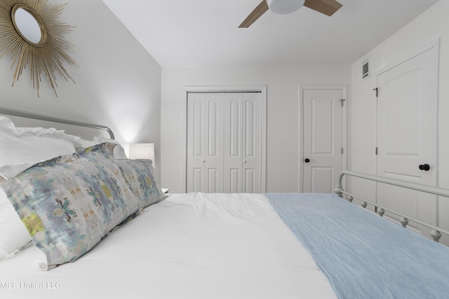 bedroom featuring ceiling fan, a closet, and visible vents