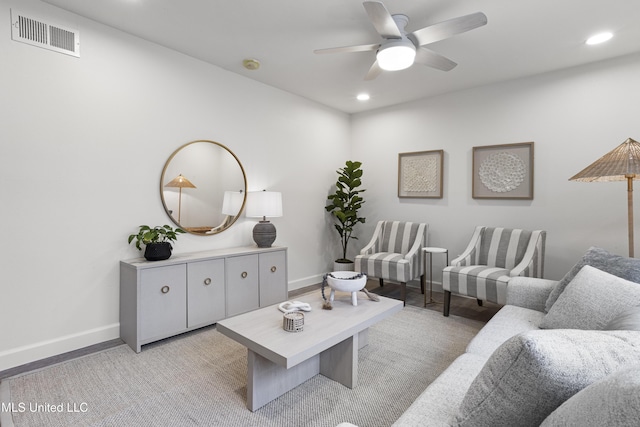 living area with a ceiling fan, recessed lighting, visible vents, and baseboards