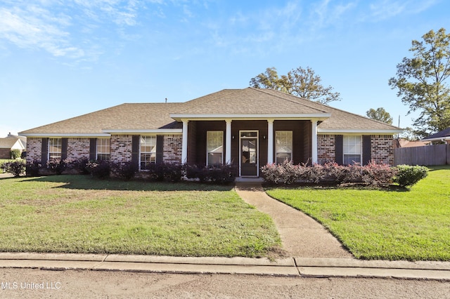 ranch-style home with a front lawn