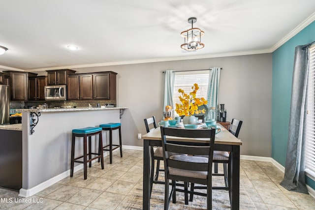 dining space featuring light tile patterned floors, crown molding, and a notable chandelier