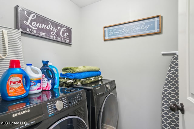 washroom featuring washer and dryer