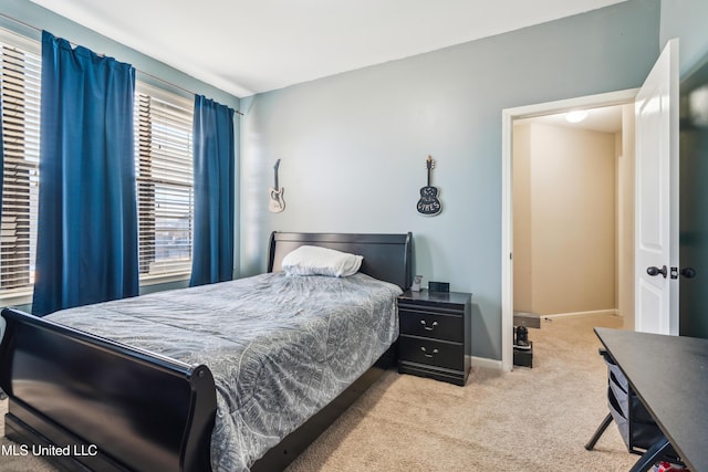 bedroom featuring light colored carpet