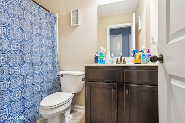 bathroom with toilet and vanity