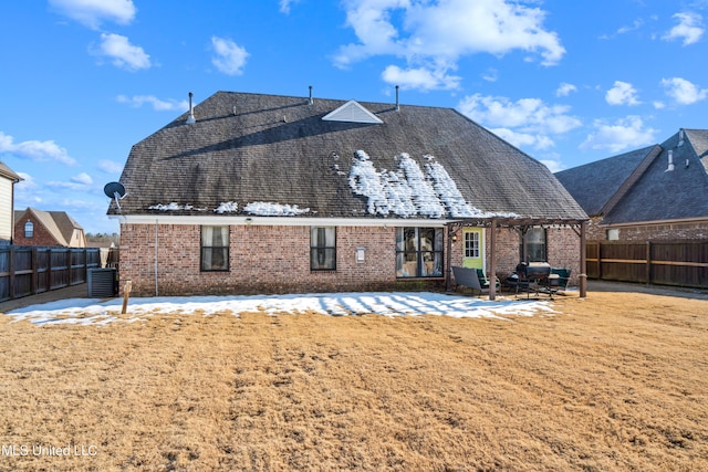 back of property with cooling unit and a yard