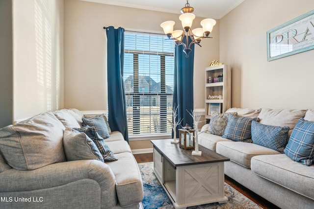 living room featuring crown molding, dark wood-type flooring, plenty of natural light, and an inviting chandelier