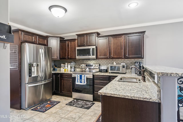 kitchen featuring decorative backsplash, sink, appliances with stainless steel finishes, ornamental molding, and dark brown cabinets