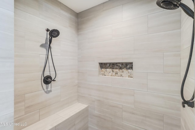 bathroom featuring a tile shower