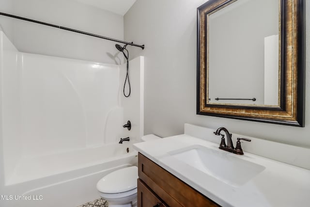 bathroom featuring bathing tub / shower combination, toilet, and vanity