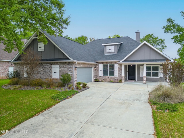 craftsman inspired home featuring brick siding, driveway, an attached garage, and board and batten siding