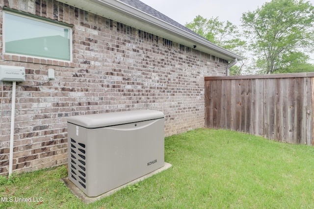 exterior space featuring brick siding, a power unit, and fence