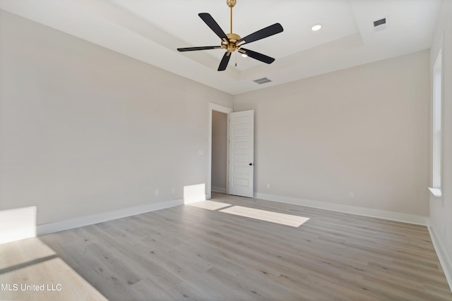 spare room with light hardwood / wood-style flooring and ceiling fan