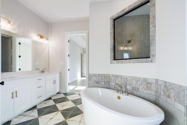 bathroom featuring vanity and a tub to relax in