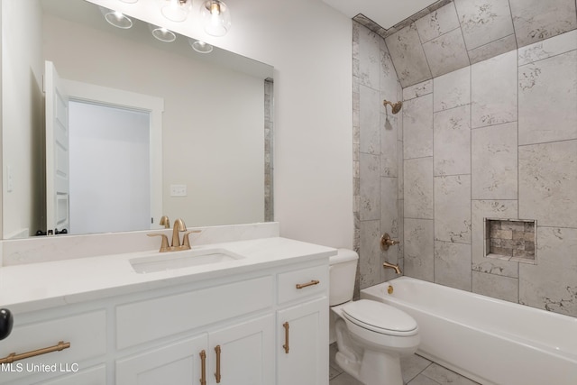 full bathroom featuring vanity, toilet, tile patterned floors, and tiled shower / bath combo