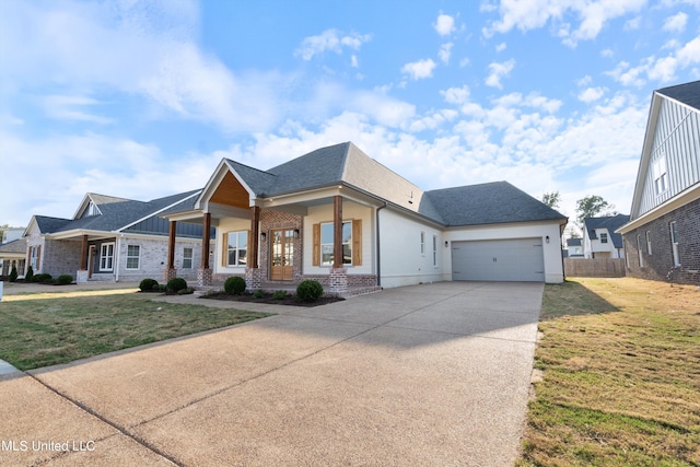 view of front of home featuring a front lawn and a garage