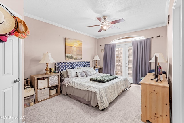 carpeted bedroom with ceiling fan, a textured ceiling, and crown molding