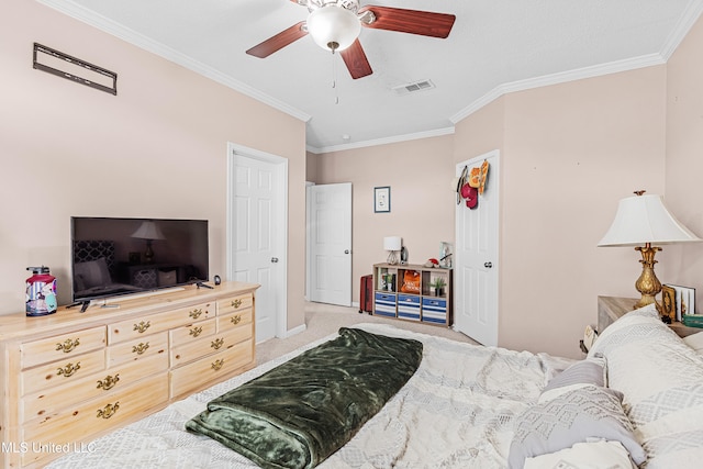 carpeted bedroom featuring ceiling fan and ornamental molding