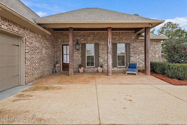 view of patio / terrace with a garage