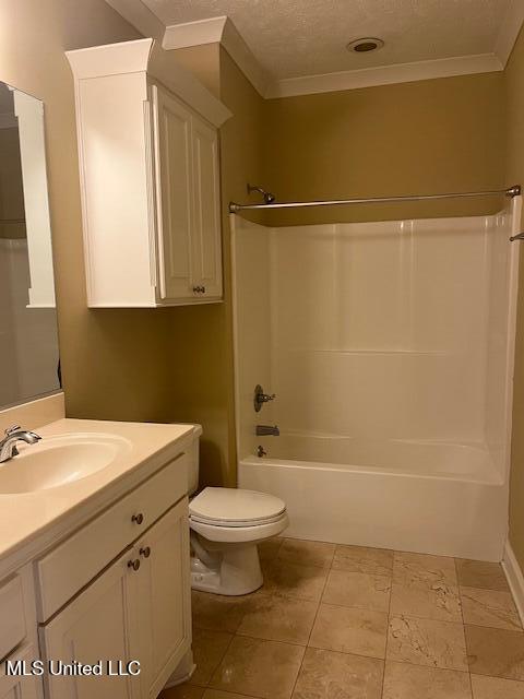 bathroom featuring crown molding, toilet, vanity, bathing tub / shower combination, and a textured ceiling