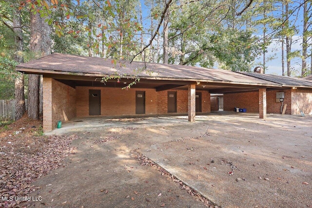 exterior space with a carport