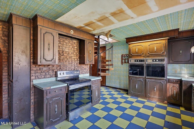 kitchen with electric stove and black oven