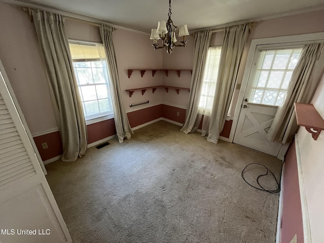 unfurnished dining area with light carpet and a notable chandelier