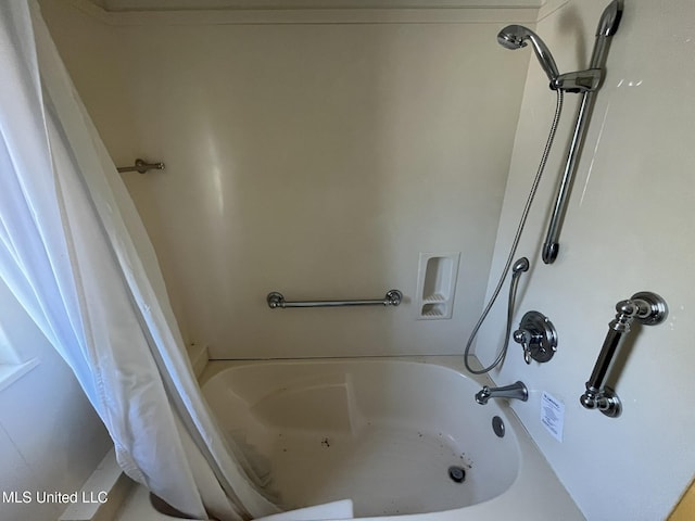 bathroom with shower / bath combination with curtain