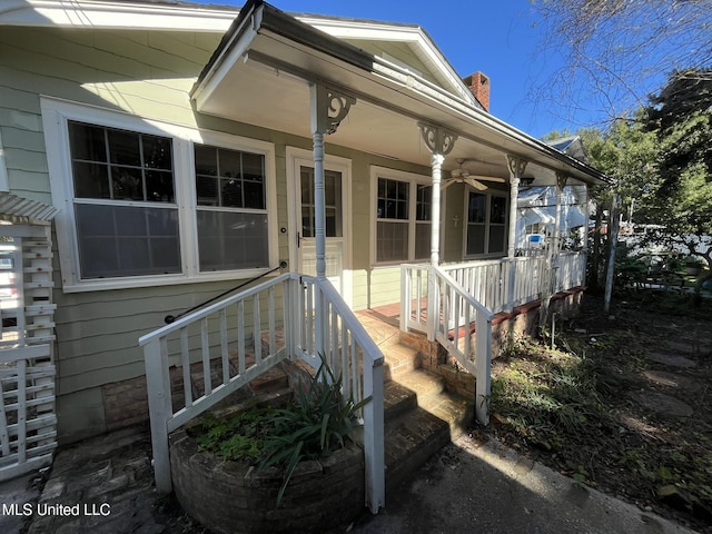 view of exterior entry with covered porch