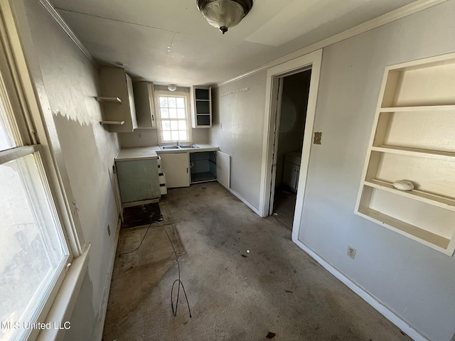 kitchen with concrete flooring and built in features