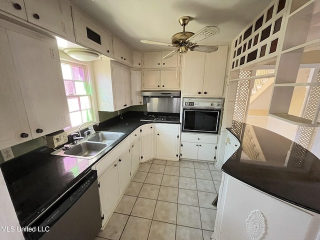 kitchen featuring light tile patterned flooring, sink, appliances with stainless steel finishes, ceiling fan, and white cabinets