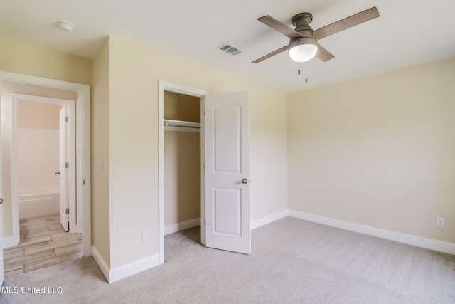 14667 Cable Bridge Rd, Gulfport, MS 39503 - unfurnished bedroom with light carpet, baseboards, a closet, and a ceiling fan