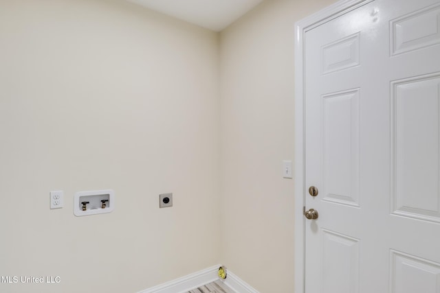 14667 Cable Bridge Rd, Gulfport, MS 39503 - laundry area featuring hookup for an electric dryer, hookup for a washing machine, and baseboards