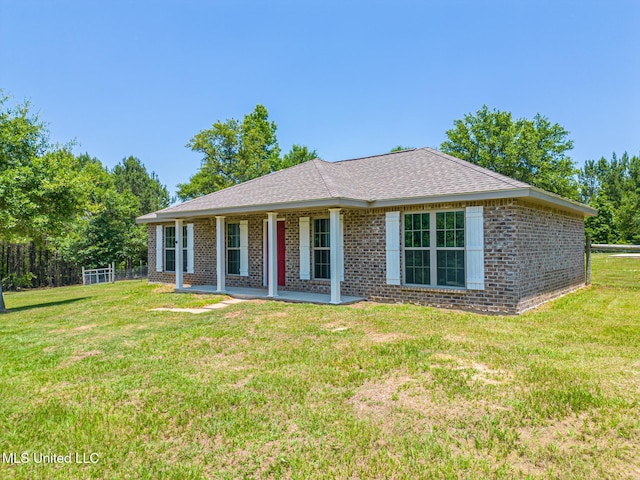 14667 Cable Bridge Rd, Gulfport, MS 39503 - single story home featuring brick siding, a front lawn, a shingled roof, and a patio