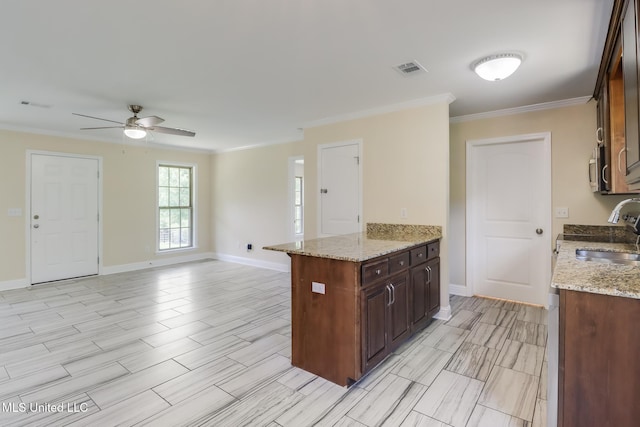 14667 Cable Bridge Rd, Gulfport, MS 39503 - kitchen featuring a sink, ornamental molding, ceiling fan, and baseboards