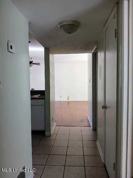 hallway with light tile patterned flooring