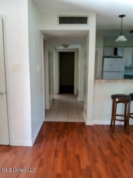 hallway featuring hardwood / wood-style flooring