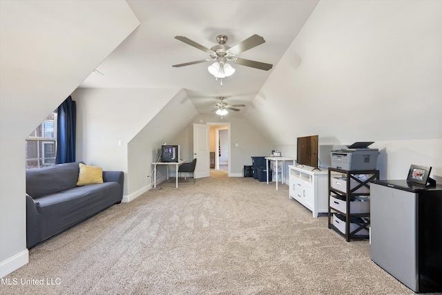 interior space featuring lofted ceiling, carpet, baseboards, and ceiling fan