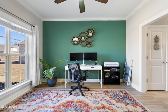 home office with wood finished floors, crown molding, a healthy amount of sunlight, and baseboards