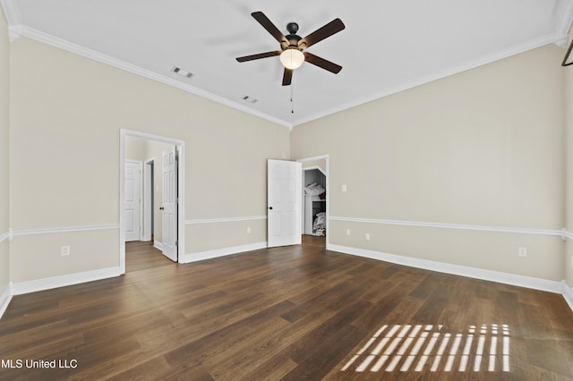 interior space featuring ceiling fan, ornamental molding, and dark hardwood / wood-style flooring