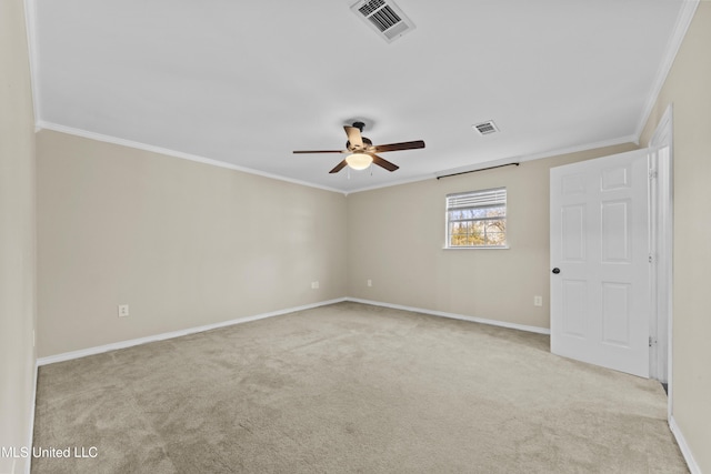 empty room with light carpet, ceiling fan, and ornamental molding