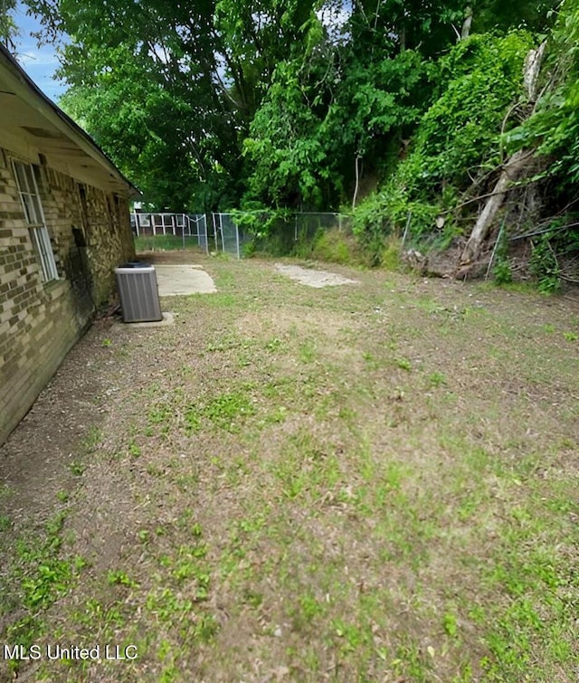 307 Pleasant Valley Dr, Vicksburg, MS 39180 - view of yard with fence and central air condition unit