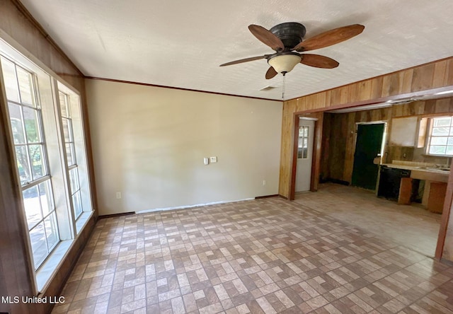 307 Pleasant Valley Dr, Vicksburg, MS 39180 - unfurnished living room with wood walls, brick patterned floors, baseboards, and ceiling fan