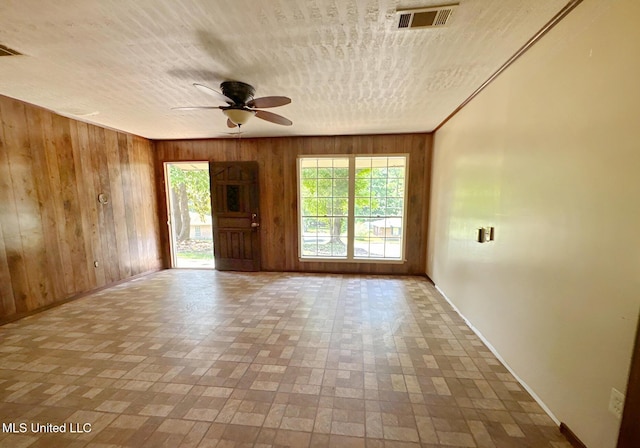 307 Pleasant Valley Dr, Vicksburg, MS 39180 - empty room with wooden walls, baseboards, and ceiling fan