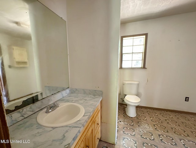 307 Pleasant Valley Dr, Vicksburg, MS 39180 - bathroom featuring toilet, vanity, and baseboards